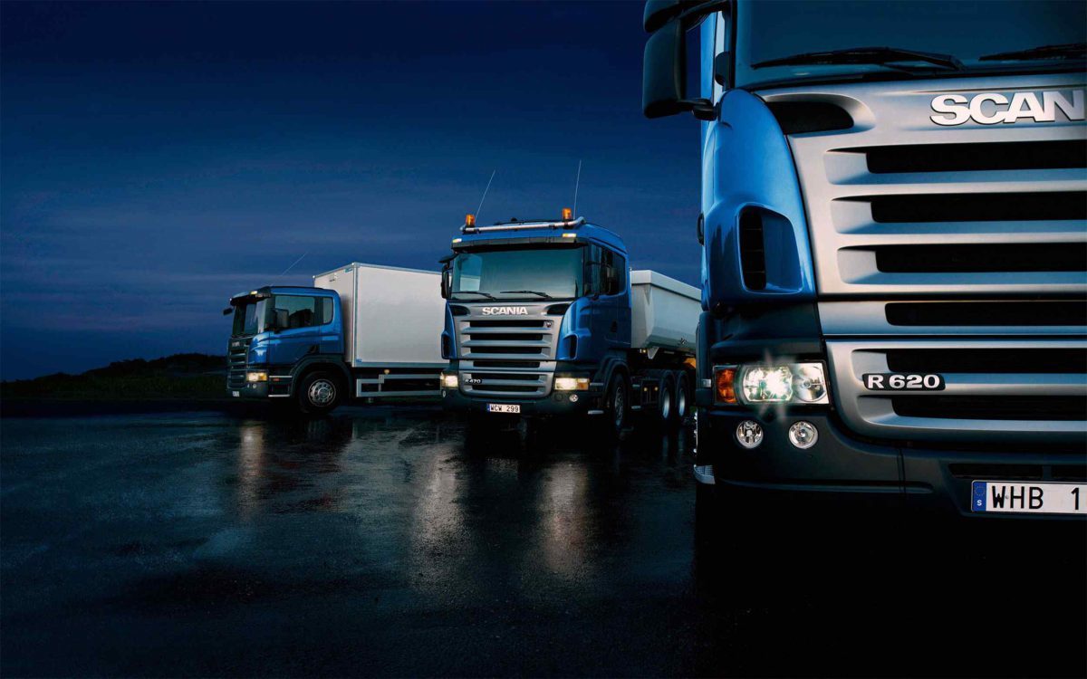 Three-trucks-on-blue-background-1200x750-1200x750.jpg